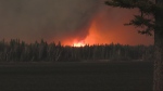 A wildfire burns in Cranberry Portage, Man., on May 12, 2024. (Keith Jaegar)