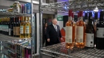 Ontario Premier Doug Ford attends a media availability at a convenience store in Toronto, Thursday, Dec. 14, 2023. A number of health organizations are asking Ontario to develop a comprehensive strategy to prepare for the province's loosening alcohol rules. THE CANADIAN PRESS/Chris Young