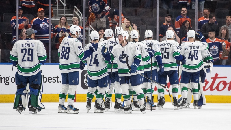 Vancouver Canucks celebrate the win over the Edmonton Oilers during second-round NHL playoff action in Edmonton on Sunday May 12, 2024.THE CANADIAN PRESS/Jason Franson