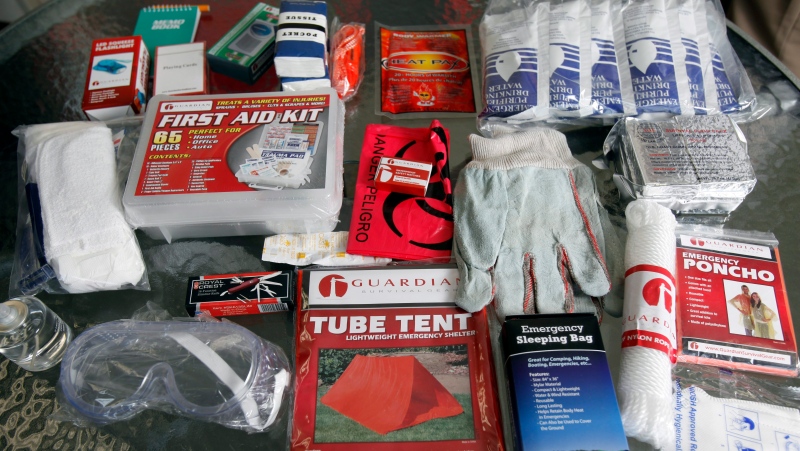 This survival kit features food, water, shelter and hygiene items for one person for 24 hours in this Feb. 8, 2013 photo. (AP Photo/The Idaho Statesman, Katherine Jones) 