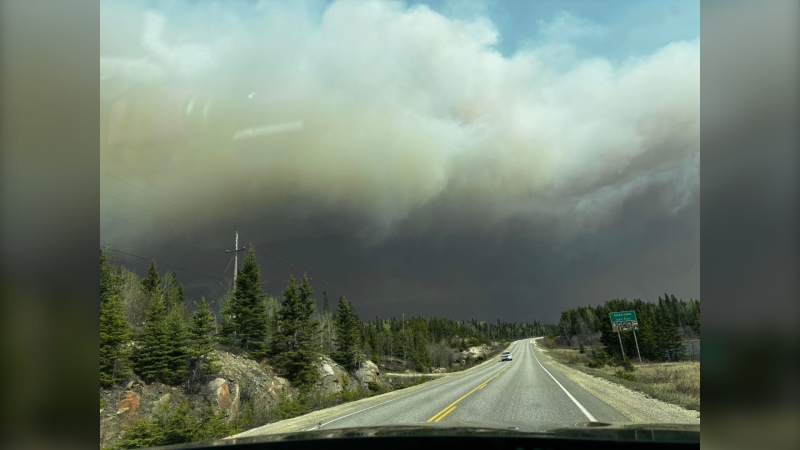 Smoke can be seen from a wildfire burning near Cranberry Portage  on May 12, 2024 (Facebook/Treena J Lathlin)