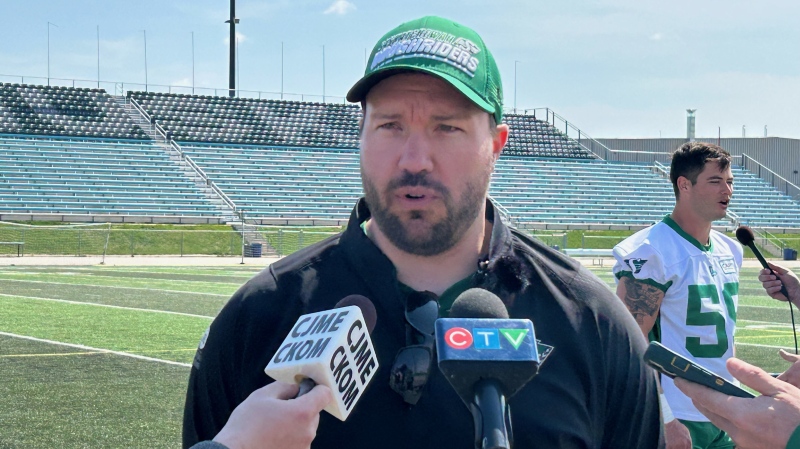 Saskatchewan Roughriders offensive coordinator Marc Mueller speaking to reporters on day two of training camp on May 13, 2024. (Brit Dort/CTV News)