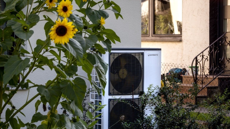 The B.C. and federal governments have set aside nearly $254 million to expand rebates that help people switch their home heating and cooling systems to more climate-friendly options with a focus on low- and middle-income households. A heat pump is installed at a house in Frankfurt, Germany, Thursday, Sept. 7, 2023. THE CANADIAN PRESS/AP-Michael Probst