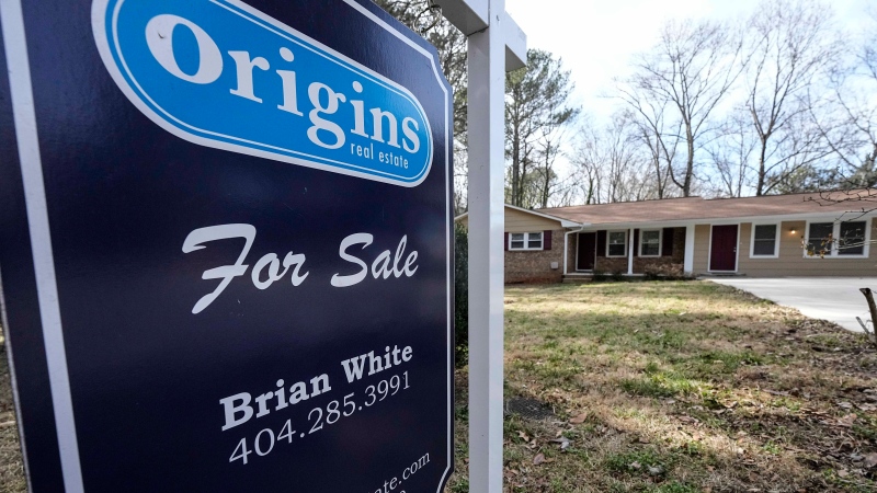 A sign announcing a home for sale is posted outside a home, Thursday, Feb. 1, 2024, in Kennesaw, Ga., near Atlanta. (AP Photo/Mike Stewart)