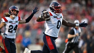 Montreal Alouettes defensive end Shawn Lemon scores a touchdown after a fumble by Ottawa Redblacks quarterback Dustin Crum, not shown, during second half CFL football action in Ottawa, Saturday, Sept. 30, 2023. (Justin Tang/The Canadian Press)