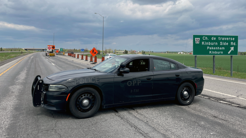 An OPP cruiser closing Hwy. 417 at Kinburn Side Road after a serious crash on May 14, 2024. (Peter Szperling/CTV News Ottawa)
