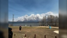 Smoke can be seen from a wildfire burning near Cranberry Portage on May 12, 2024 (Facebook/Treena J Lathlin)
