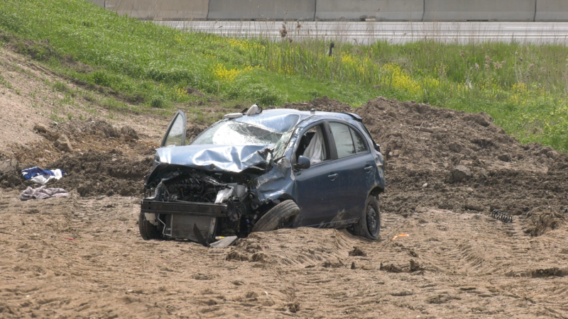 The driver of an SUV suffered serious injuries after their vehicle left the road and tumbled down a steep embankment at Highbury Avenue and Highway 401 in London, Ont. on May 14, 2024. (Gerry Dewan/CTV News London)
