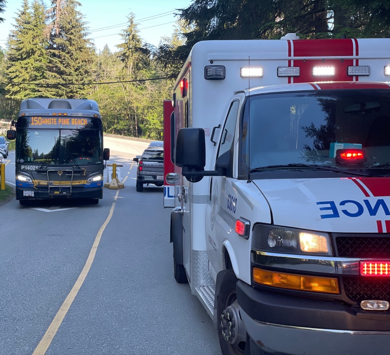 A photo shared with the news release shows a bus displaying "150 White Pine Beach." (Port Moody Police Department)