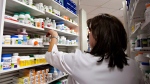A lab technician prepares a prescription at a Quebec City pharmacy, Thursday, March 8, 2012. LA PRESSE CANADIENNE/Jacques Boissinot
