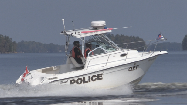 OPP officers on the water in Gravenhurst, Ont. (CTV News/Catalina Gillies)