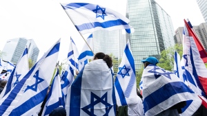 Supporters of Israel gather to celebrate the country's Independence Day in Montreal on Tuesday, May 14, 2024. THE CANADIAN PRESS/Christinne Muschi