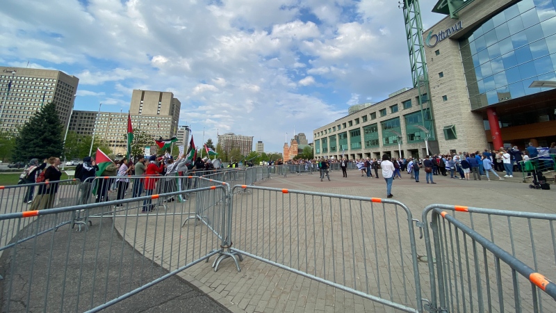 Pro-Palestinian protesters arrive at a ceremony to mark Israeli Independence Day at Ottawa City Hall. May 14, 2024. (Leah Larocque/CTV News Ottawa)