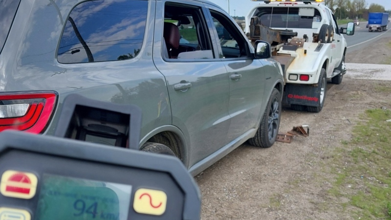 A tow truck hooks up a vehicle to take to the impound yard after a police radar device allegedly clocked a speed of 94km/h in a posted 50km/h zone on Tues., May 14, 2024. (Source: Caledon OPP)