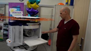 Matthew Malach, an MRI technician at Jim Pattison Children’s Hospital with the new portable MRI on May 14, 2024. (Laura Woodward / CTV News)