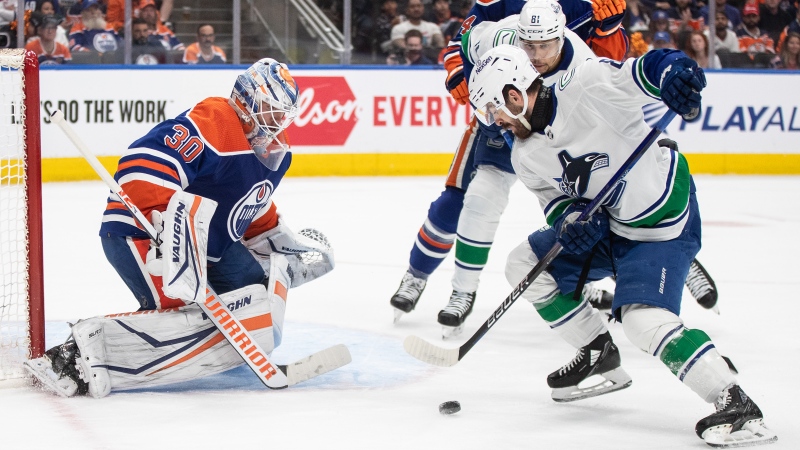 Vancouver Canucks' Conor Garland (8) is stopped by Edmonton Oilers goalie Calvin Pickard (30) during first period second-round NHL playoff action in Edmonton on Tuesday May 14, 2024.THE CANADIAN PRESS/Jason Franson