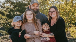 Nine-year-old Carter Vigh, wearing a red sweatshirt, is pictured with his brother Daxton (left), sister Cadence, father James and mother Amber. Carter died of asthma exacerbated by wildfire smoke in July 2023. As wildfires rage in B.C., his family is trying to protect people from poor air quality due to smoke this year. THE CANADIAN PRESS/HO-Vigh Family
