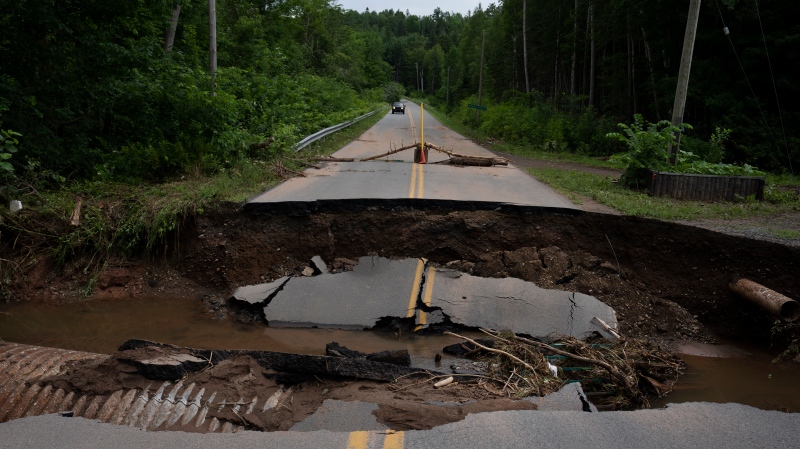 Damage to a washed-out roadway is pictured near McKay Section, N.S., on July 23, 2023. THE CANADIAN PRESS/Darren Calabrese