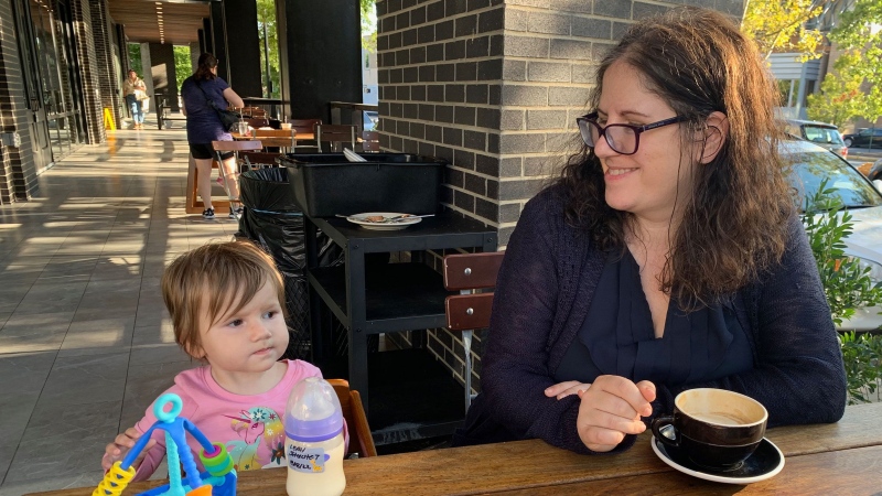 In this photo from a calmer moment a few months earlier, my daughter takes in the sights as we pause for a break at our local coffee shop. (Catherine Shoichet / CNN)