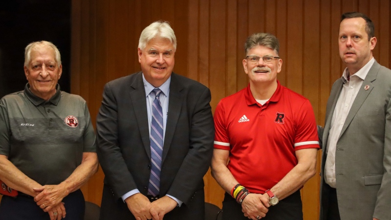 Dave Morell, UNB president and vice chancellor Dr. Paul Mazerolle, coach Gardiner MacDougall, and REDS executive director John Richard are pictured. (Source: Evan Richtsfeld/UNB Athletics)
