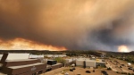 A wildfire burns near Fort McMurray, Alta. on May 14, 2024. (Credit: Zoran Knezic)