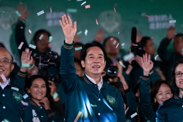 Taiwan's Lai Ching-te, also known as William Lai, left, celebrates his victory with running mate Bi-khim Hsiao in Taipei, Taiwan, Jan. 13, 2024. (AP Photo/Louise Delmotte, File)
