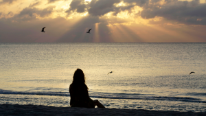  A woman meditates on the beach in Miami Beach, Fla., on April 28, 2010. (AP Photo/Lynne Sladky)