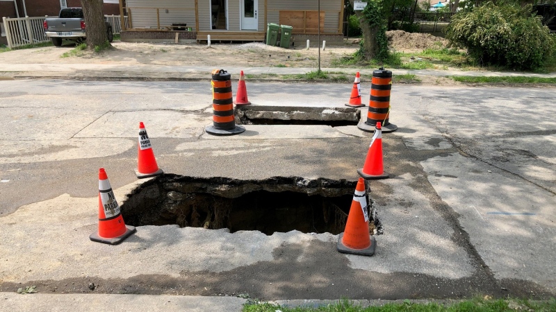 Sinkholes on Peter Street in Windsor, Ont., on Wednesday, May 15, 2024. (Gary Archibald/CTV News Windsor)