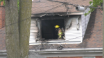 Fire crews faced intense smoke and flames in an apartment on William Street on May 15, 2024. (Gerry Dewan/CTV News London) 