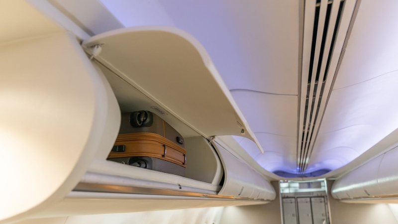 Airplane overhead lockers are designed to accomodate luggage -- not people. (coffeekai/iStockphoto/Getty Images via CNN Newsource)