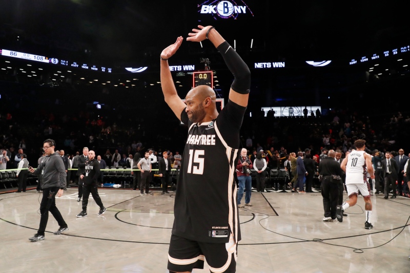 Atlanta Hawks guard Vince Carter (15) acknowledges the crowd after playing in an NBA basketball game against the Brooklyn Nets, Sunday, Jan. 12, 2020, in New York. (AP Photo/Kathy Willens)