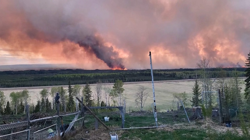 A wildfire burns outside of Fort Nelson, B.C. in May, 2024. 