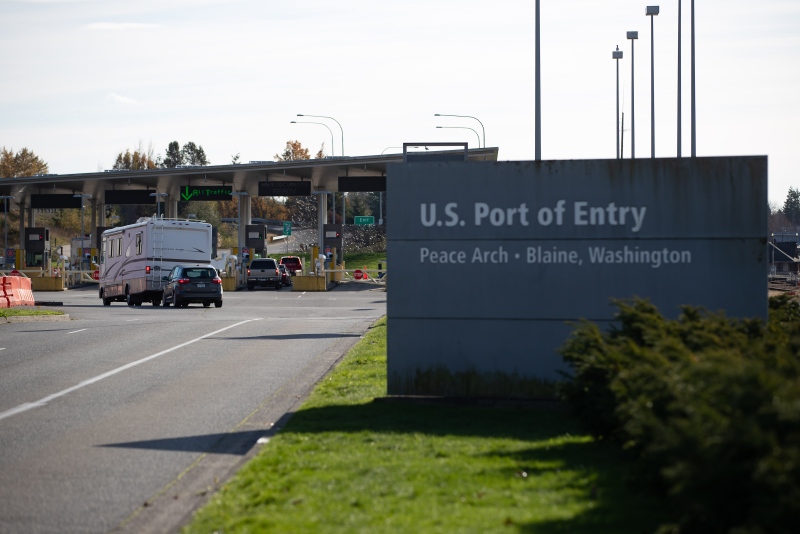 A motorist drives a recreational vehicle towards U.S. Customs and Border Protection inspection booths at the Peace Arch border crossing in Blaine, Wash., across the Canada-U.S. border from Surrey, B.C., on Monday, November 8, 2021. THE CANADIAN PRESS/Darryl Dyck