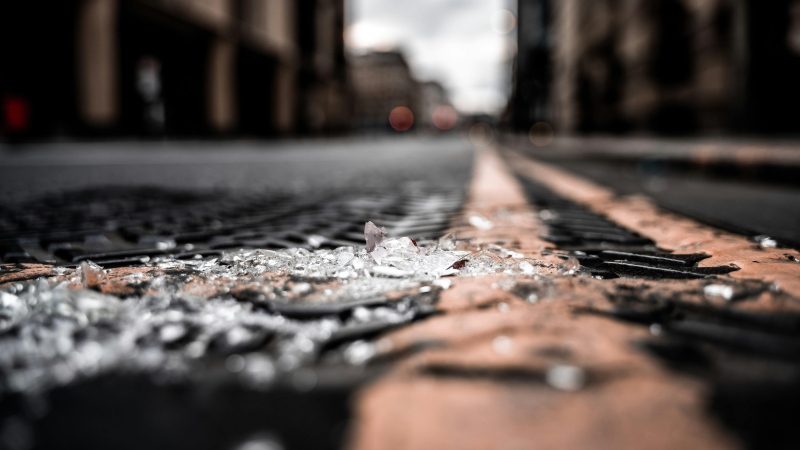 A stock image of broken glass on the ground. (Pexels/David Geib)