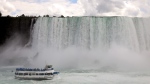 A crowded Maid of the Mist tour boat operated from the American side of the Niagara River is seen from Niagara Falls, Ont., on Tuesday, July 14, 2020. (THE CANADIAN PRESS/Colin Perkel)
