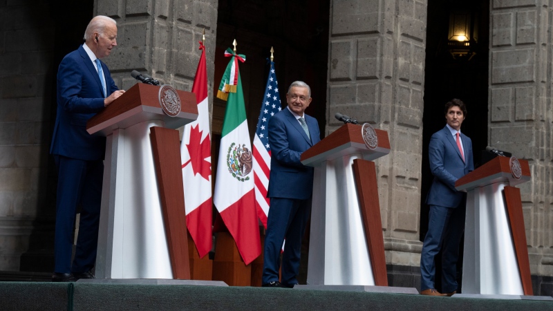 U.S. President Joe Biden and Prime Minister Justin Trudeau listen to Mexican President Andres Manuel Lopez Obrador speak in Mexico City, Tuesday, Jan. 10, 2023. THE CANADIAN PRESS/Adrian Wyld