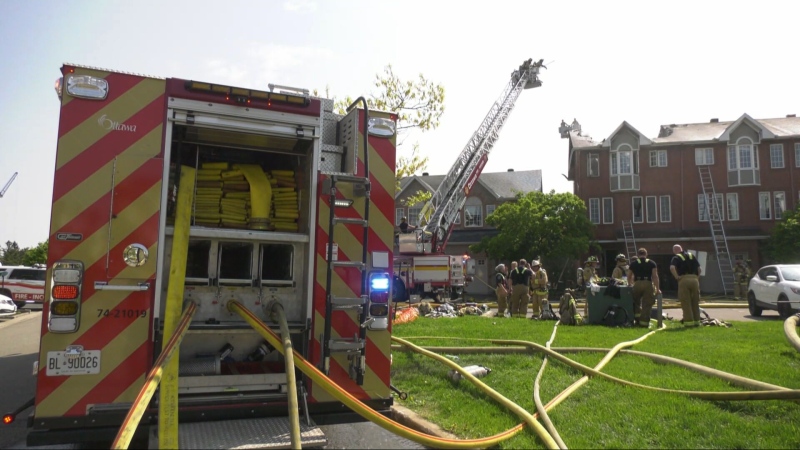 Emergency responders at the scene of a fire at a townhouse in Ottawa's Alta Vista neighbourhood on Thursday, May 16, 2024.