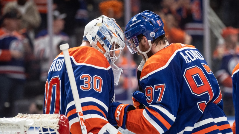 Edmonton Oilers goalie Calvin Pickard (30) and Connor McDavid (97) celebrate the win over the Vancouver Canucks during second-round NHL playoff action in Edmonton on Tuesday May 14, 2024.THE CANADIAN PRESS/Jason Franson