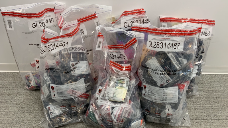 Several large plastic bags of illegal psilocybin products sit on the floor after a Waterloo Regional Police Service raid on May 16, 2024. (Courtesy: Waterloo Regional Police Service)