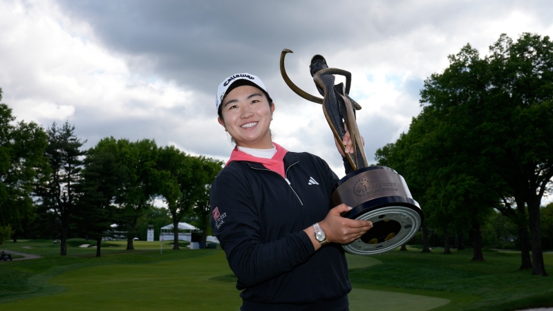 Rose Zhang poses for pictures after winning the LPGA Cognizant Founders Cup golf tournament, Sunday, May 12, 2024, in Clifton, N.J. (AP Photo/Seth Wenig)