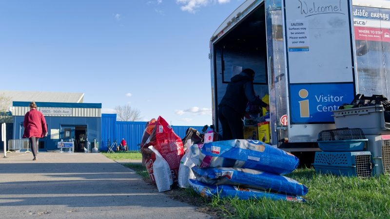 Food and animal supplies are available for evacuees at the North Peace Arena in Fort St. John, B.C., on Monday, May 13, 2024. Wildfires are forcing more people to evacuate their homes in dry and windy northeastern B.C. THE CANADIAN PRESS/Jesse Boily