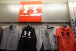 In this Nov. 29, 2019, file photo Under Armour clothes are displayed at a Kohl's store in Colma, Calif. (AP Photo/Jeff Chiu, File)