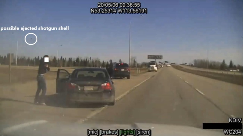 A frame from RCMP video of a shooting incident on May 6, 2020, in which an armed man was shot and killed by police in an exchange of gunfire on Highway 2 near Leduc, Alta. (Credit: ASIRT)