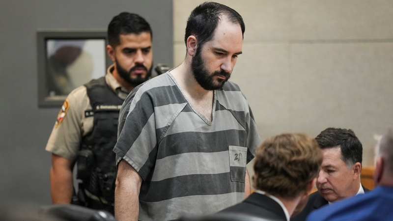 Daniel Perry enters the 147th District Courtroom at the Travis County Justice Center for his sentencing, Tuesday, May 9, 2023, in Austin, Texas.  (Mikala Compton/Austin American-Statesman via AP)