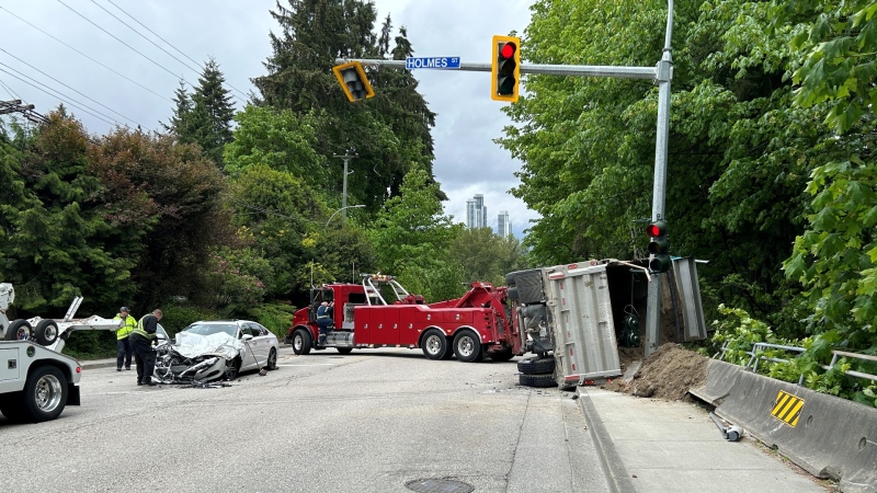 For the second time in three days, a crash involving a dump truck shut down a busy intersection in New Westminster Thursday. (Jordan Jiang / CTV News)