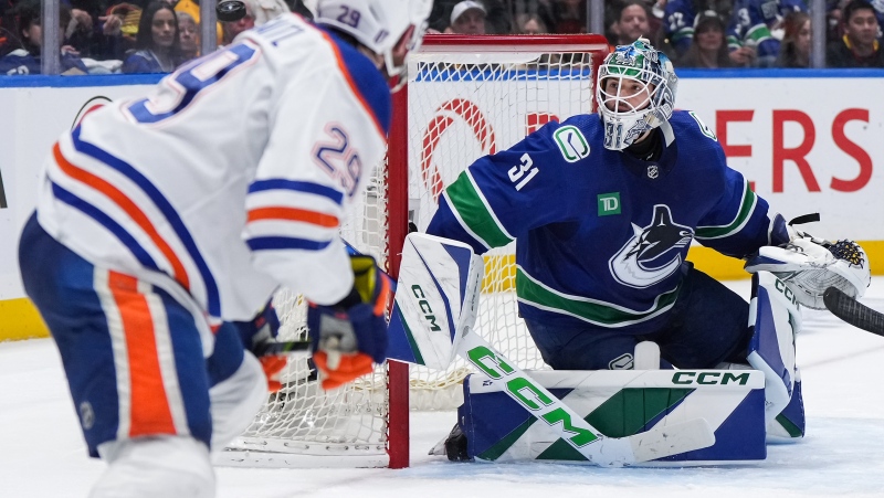 Vancouver Canucks goalie Arturs Silovs watches as Edmonton Oilers' Leon Draisaitl puts a shot wide of the net in Game 5 on May 16, 2024. (THE CANADIAN PRESS/Darryl Dyck)