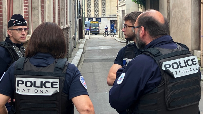 French policemen stand near the synagogue in Rouen, France, Friday, May 17, 2024. (AP Photo/Oleg Cetinic)