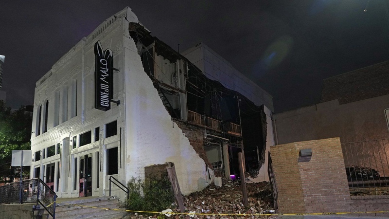 A damaged building is shown in the aftermath of a severe thunderstorm that passed through downtown, Thursday, May 16, 2024, in Houston. (David J. Phillip / The Associate Press)