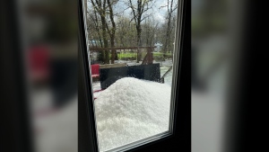 Hail is seen piled outside a window in Charleswood on May 17, 2024. (Simone Bucher)