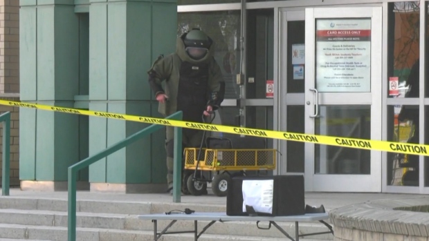A member of the Winnipeg police bomb unit removes a 'volatile substance' from the St. Boniface Hospital Albrechtsen Research Centre on May, 17, 2024. (Source: Jeff Keele/CTV News Winnipeg)